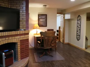 reading table with chair with lamp on the TV lounge with tv on the wall