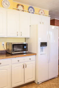 Kitchen with oven and white shelves