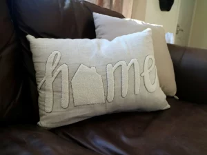 home written on a cushion