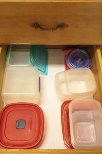 hard plastic bowl with covers in a rack