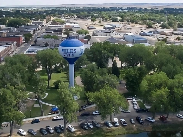 An aerial view of a city with a water tower.