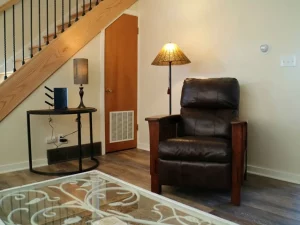 sitting chair with wifi router on the side table with lamp