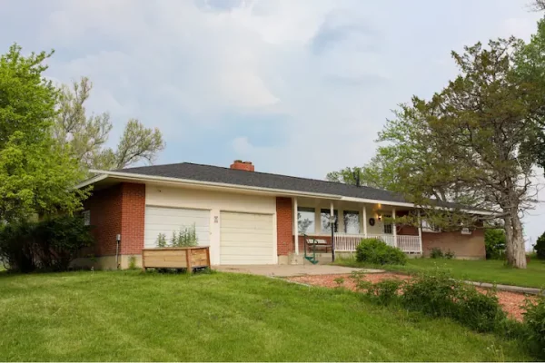 House with lawn and tree